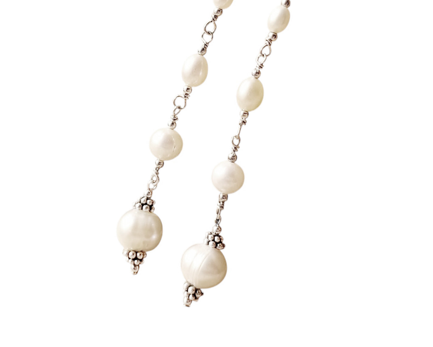 Long art deco style pearl earrings, white Freshwater Cultured Pearls, accented with fancy Sterling Silver beads on white background