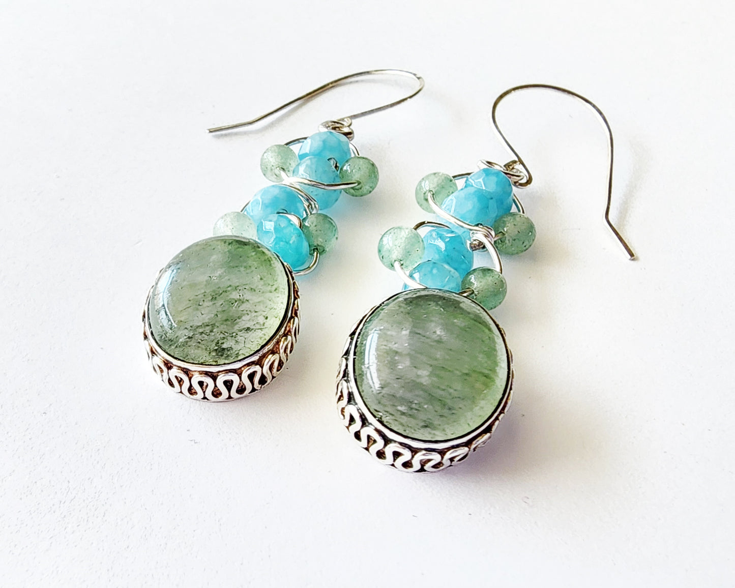 Long Dangle Earrings with large oval shaped Aventurine stones (soft green color) with a long design with blue Quartz and Aventurine beads and Sterling Silver. On French style earring hooks. 