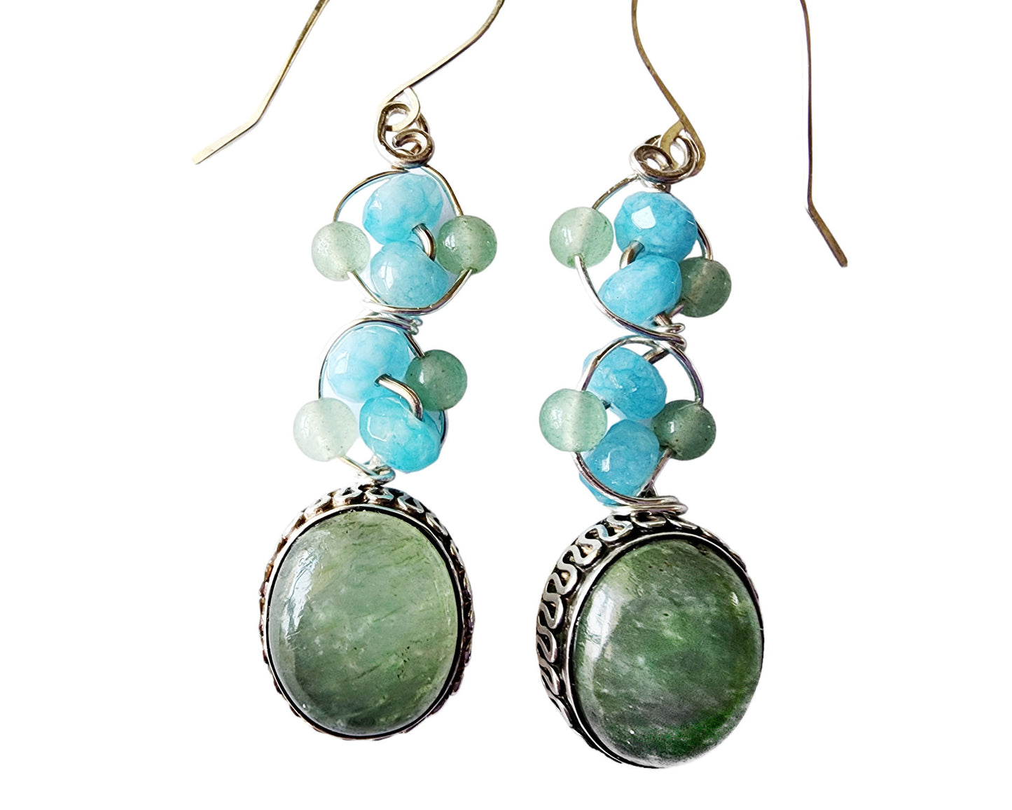 Long Dangle Earrings with large oval shaped Aventurine stones (soft green color) with a long design with blue Quartz and Aventurine beads and Sterling Silver. On French style earring hooks. 