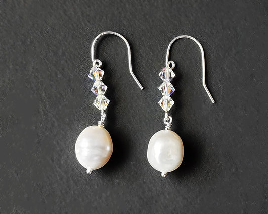 White pearl clear AB Crystal threader dangle style earrings Silver french hooks with three clear AB crystals and large white pearl dangles on black background