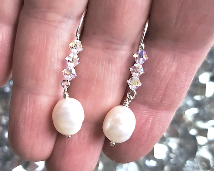 White pearl clear AB Crystal threader dangle style earrings Silver french hooks with three clear AB crystals and large white pearl dangles on hand 