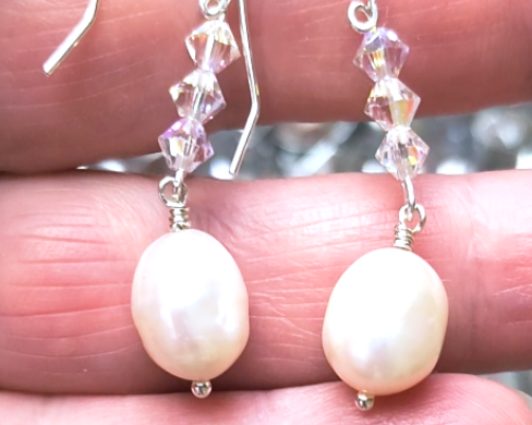 White pearl clear AB Crystal threader dangle style earrings Silver french hooks with three clear AB crystals and large white pearl dangles on hand