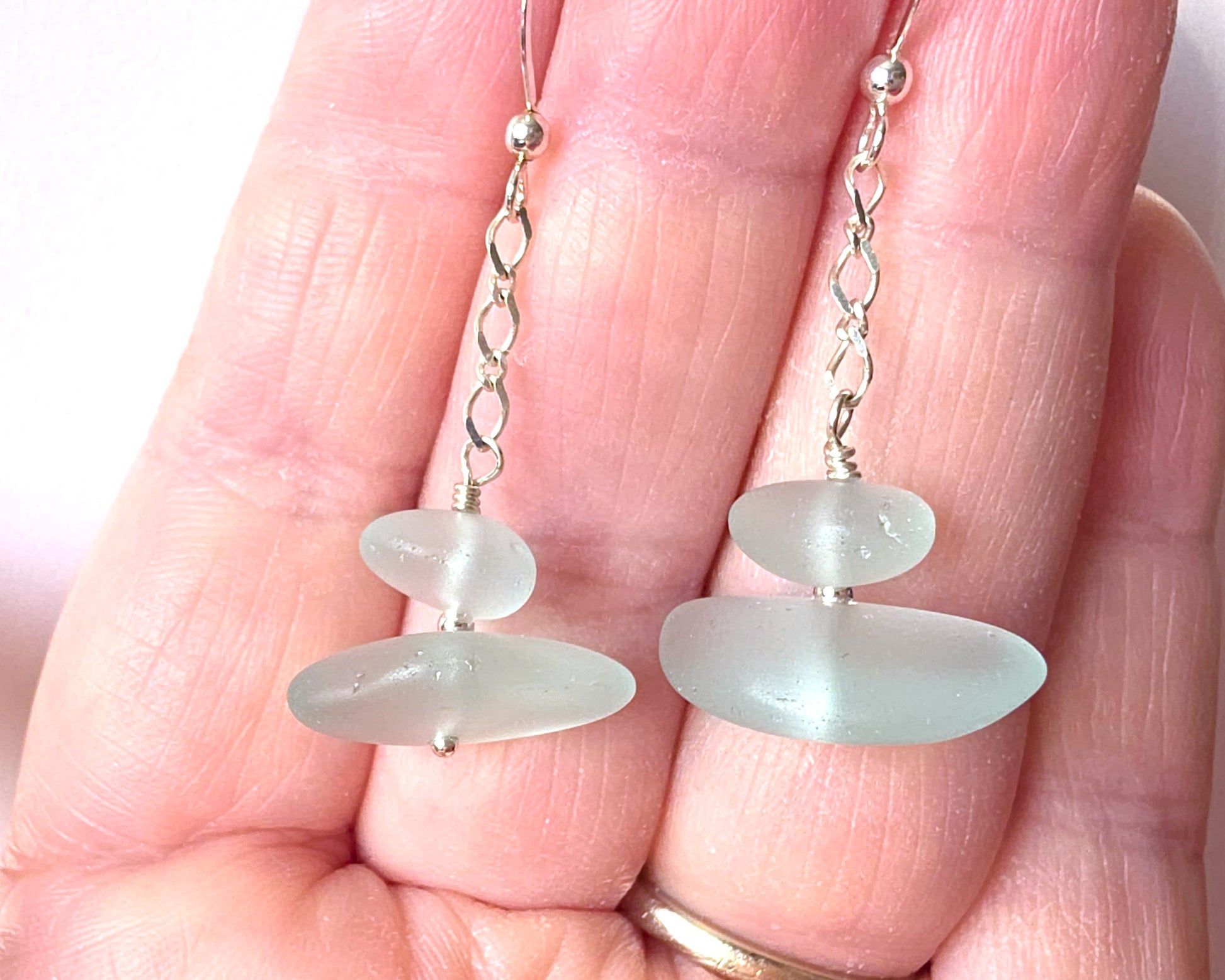 A pair of Long handmade Sterling Silver Pale Aqua blue Sea glass earrings with blue satin glass on long chain with french style earring hooks on hand 