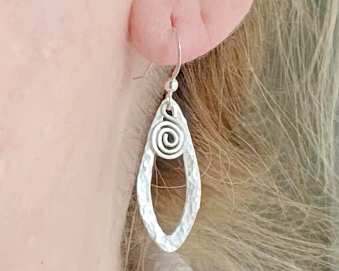 Sterling Silver, long Celtic style Dragonfly Wing earrings with dangling Eternity Coils on French style earring hooks dangling from Ear