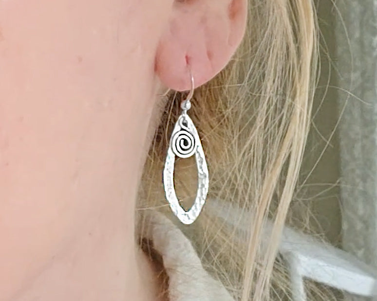 Sterling Silver, long Celtic style Dragonfly Wing earrings with dangling Eternity Coils on French style earring hooks dangling from Ear