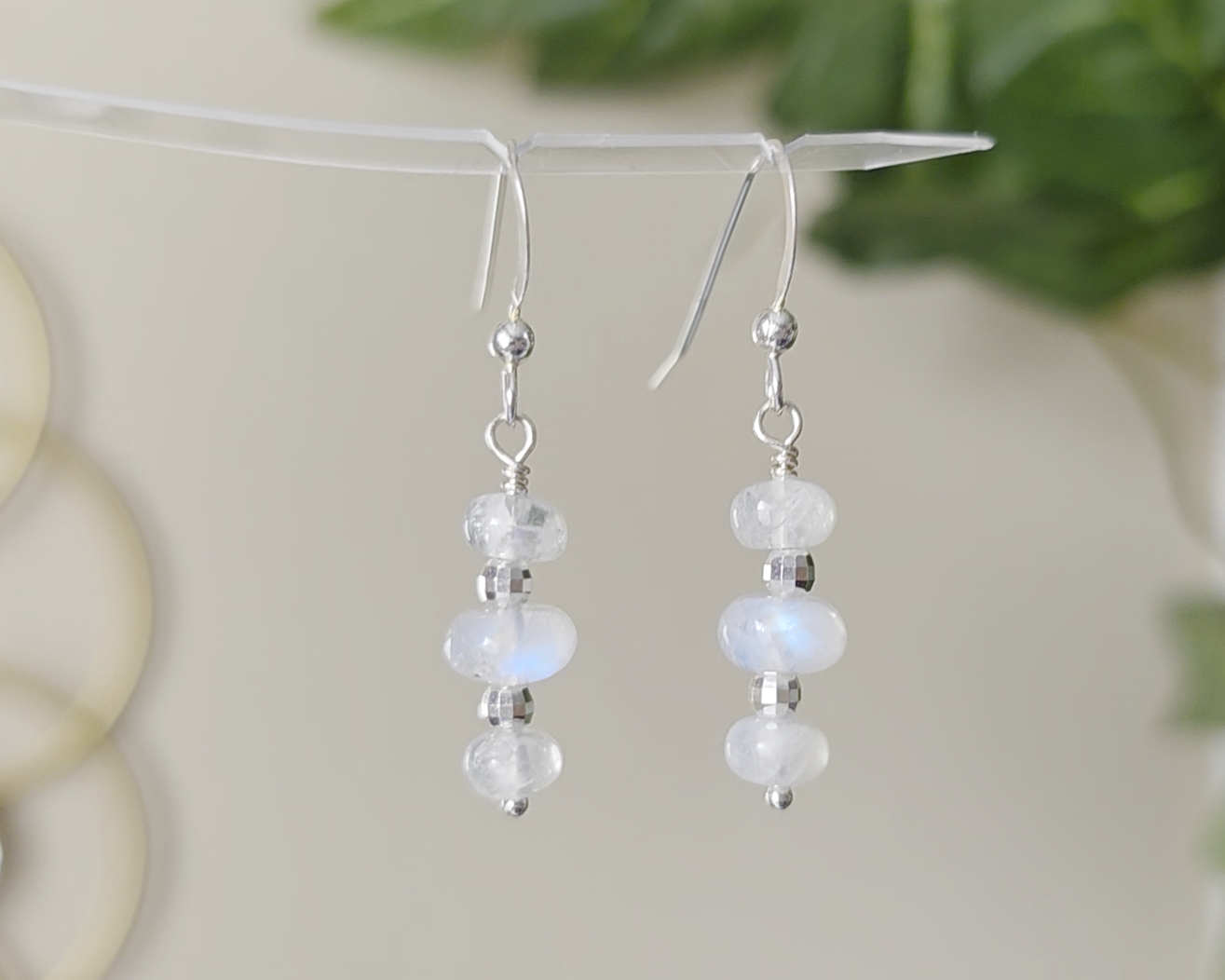 Sterling Silver Dangle Earrings with Three milky white Moonstones with blue and Sterling Silver sparkly beads dangling from silver French earring hooks 