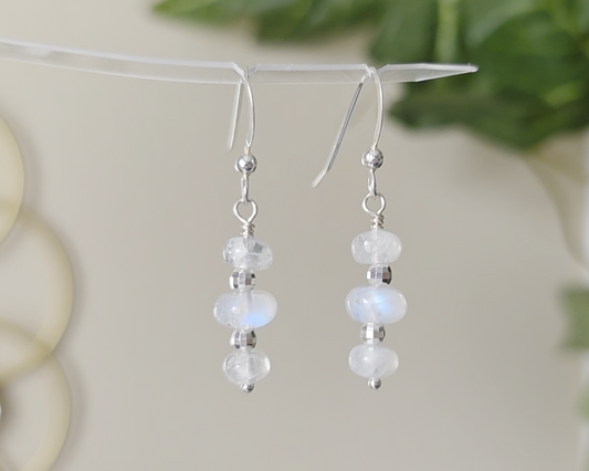 Sterling Silver Dangle Earrings with Three milky white Moonstones with blue and Sterling Silver sparkly beads dangling from silver French earring hooks 