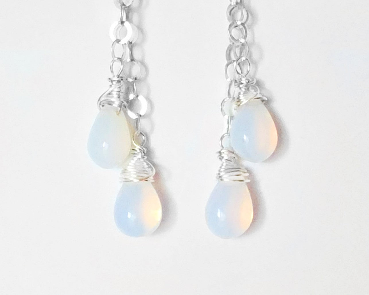 Long Sterling Silver double chain earrings with Opalite drops wrapped with Sterling Silver wire with French earring hooks on white background