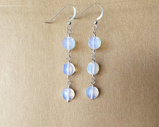 Long Three Stone Opalite Earrings with Sterling Silver Earring hooks on beige background 