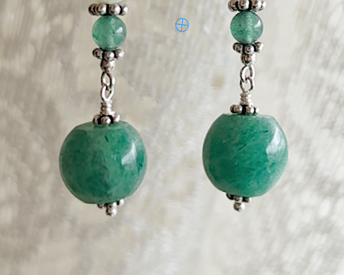 Long green gemstone earrings with deeper green aventurine  and decorative sterling silver beads with lace background