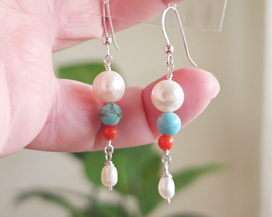 Long Turquoise Coral and Freshwater Cultured pearl dangle beaded earrings on silver french hooks in hand