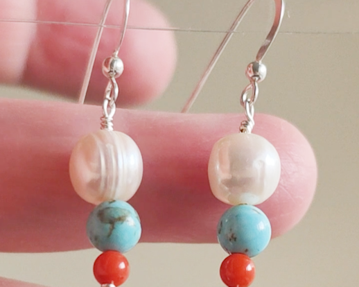 Long Turquoise Coral and Freshwater Cultured pearl dangle beaded earrings on silver french hooks in hand