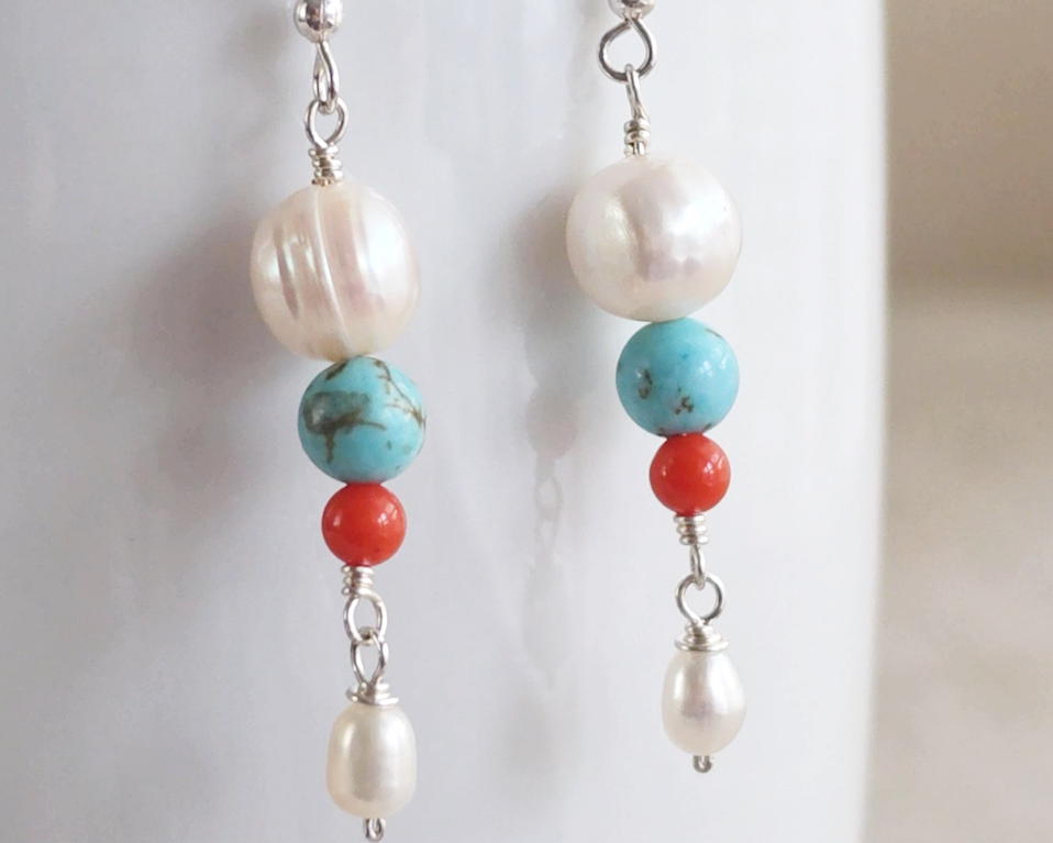 Long Turquoise Coral and Freshwater Cultured pearl dangle beaded earrings on silver french hooks on white 