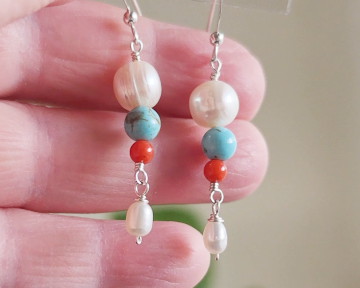 Long Turquoise Coral and Freshwater Cultured pearl dangle beaded earrings on silver french hooks in hand