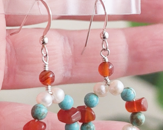 Handmade long dangle sterling silver Carnelian, Turquoise and Freshwater Cultured pearl earrings on french hooks in hand 