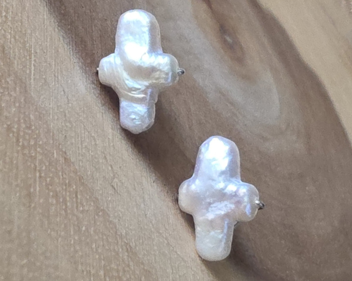 Sterling Silver Freshwater Cultured Peal Cross Stud Earrings with wood background.