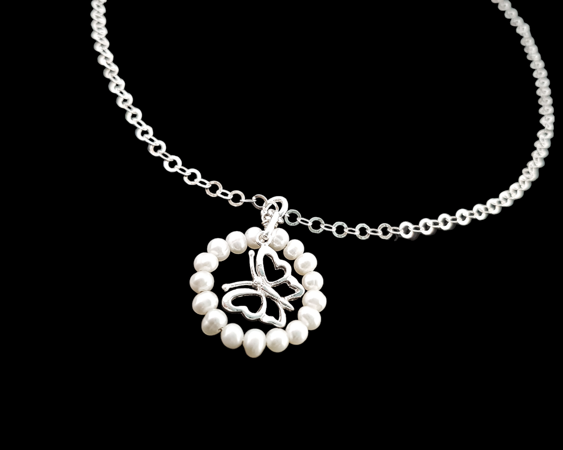 Butterfly Pearl Eternity Necklace-Sterling Silver Butterfly inside a White Freshwater Cultured Pearl Eternity Ring Pendant on Sparkly chain.