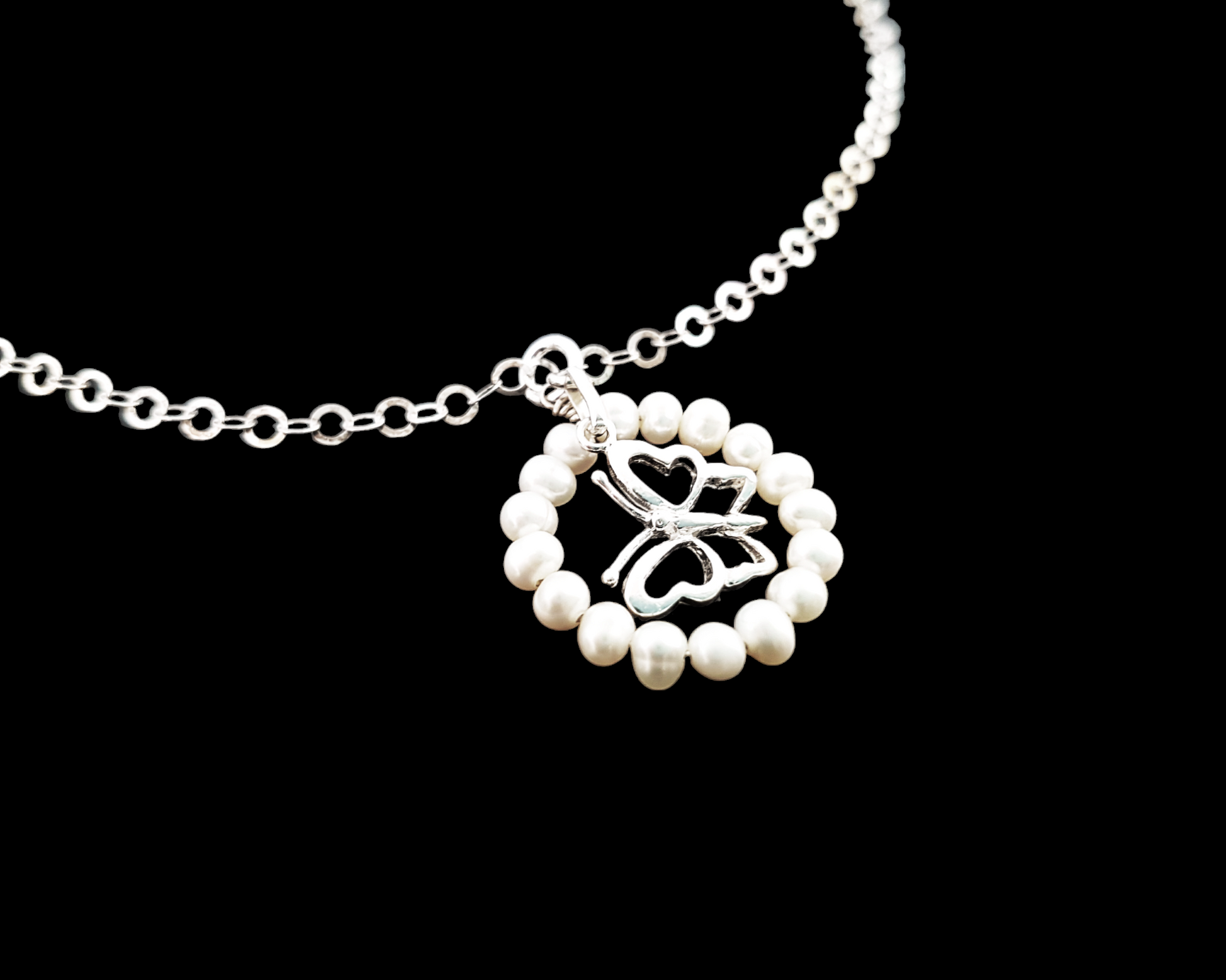 Butterfly Pearl Eternity Necklace-Sterling Silver Butterfly inside a White Freshwater Cultured Pearl Eternity Ring Pendant on Sparkly chain.