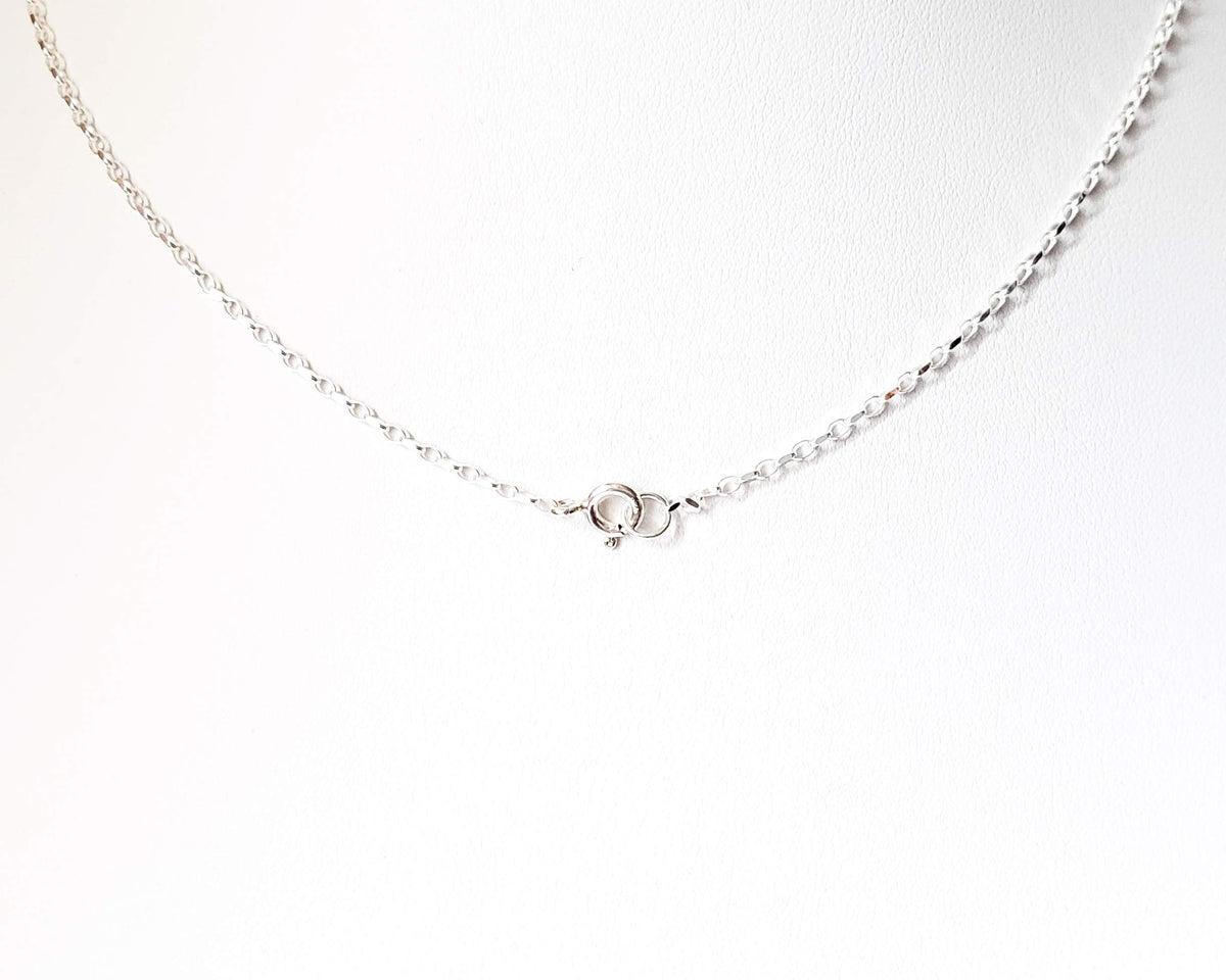 Sterling Silver Spring Ring clasp on oval chain on white background 