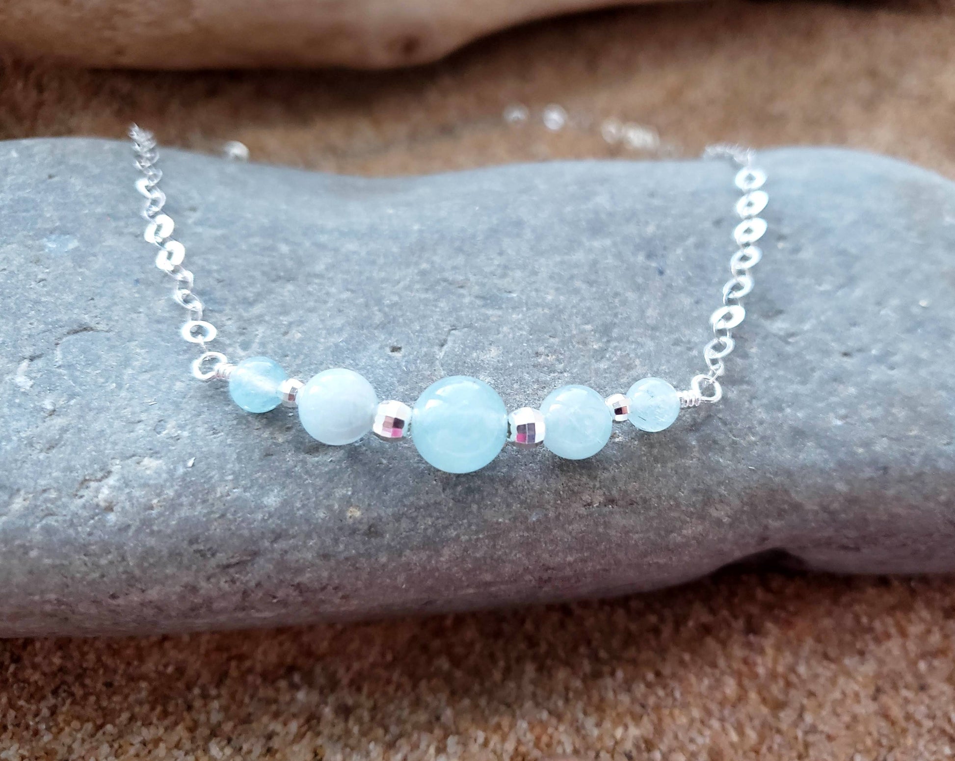 Aquamarine Peaceful Journey Necklace with five Aquamarine stones Sterling Silver beads and sparkly chain.