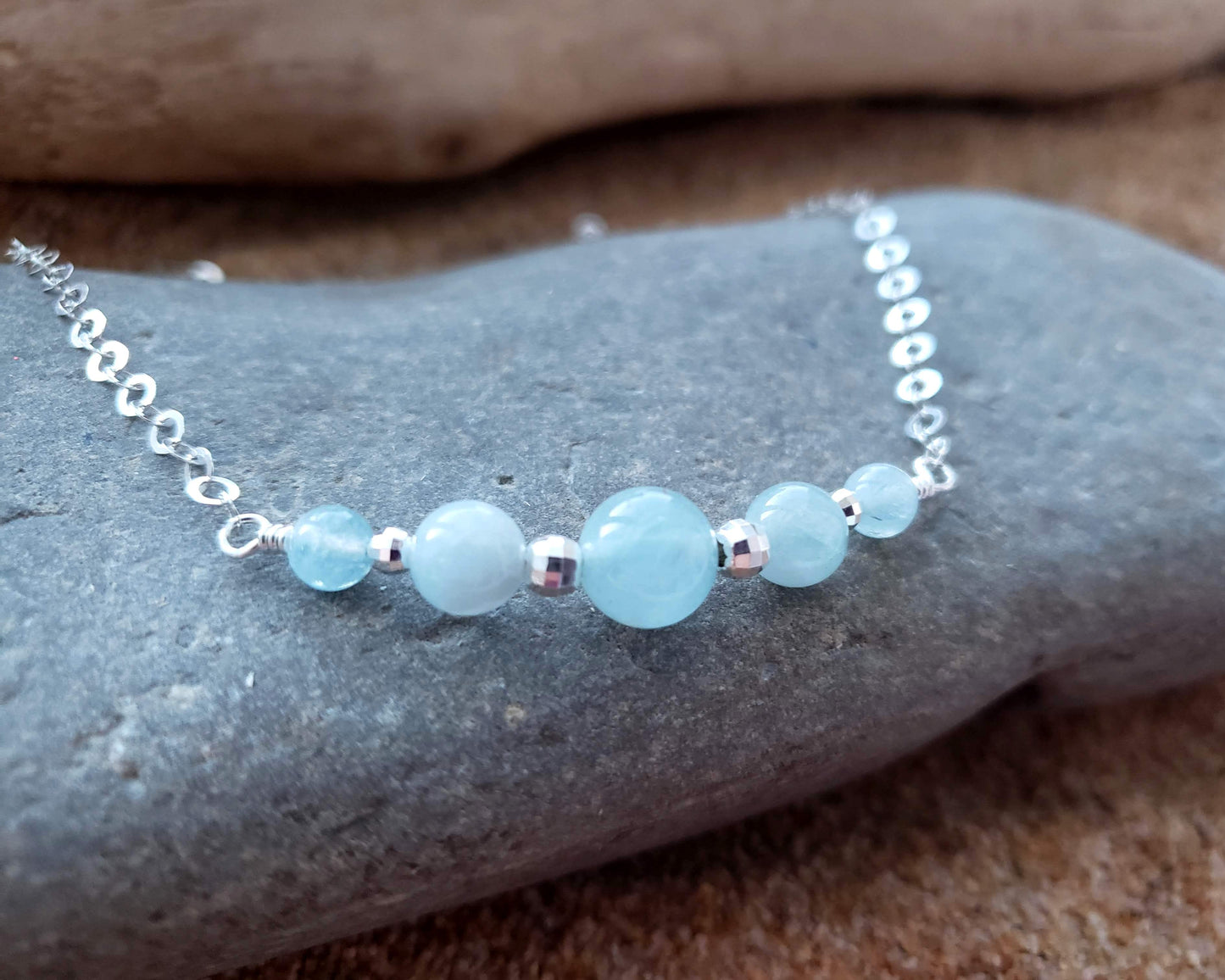 Aquamarine Peaceful Journey Necklace with five Aquamarine stones Sterling Silver beads and sparkly chain.