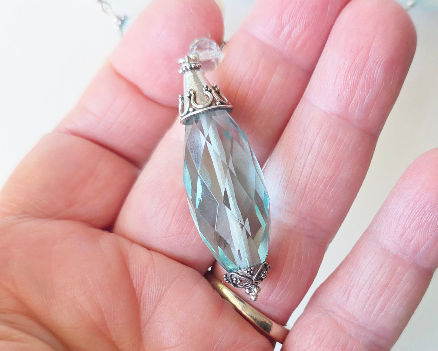  large faceted, sparkly pale aqua blue translucent synthetic Aquamarine stones and Sterling Silver in hand 