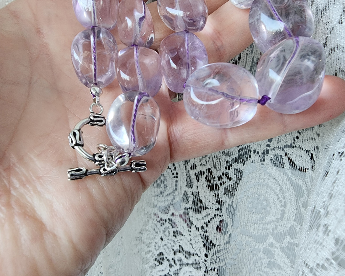 Translucent lavender Amethyst Nugget necklace, hand knotted with genuine Silk cord, finished with Sterling Silver and fancy antiqued Toggle Clasp on hand 