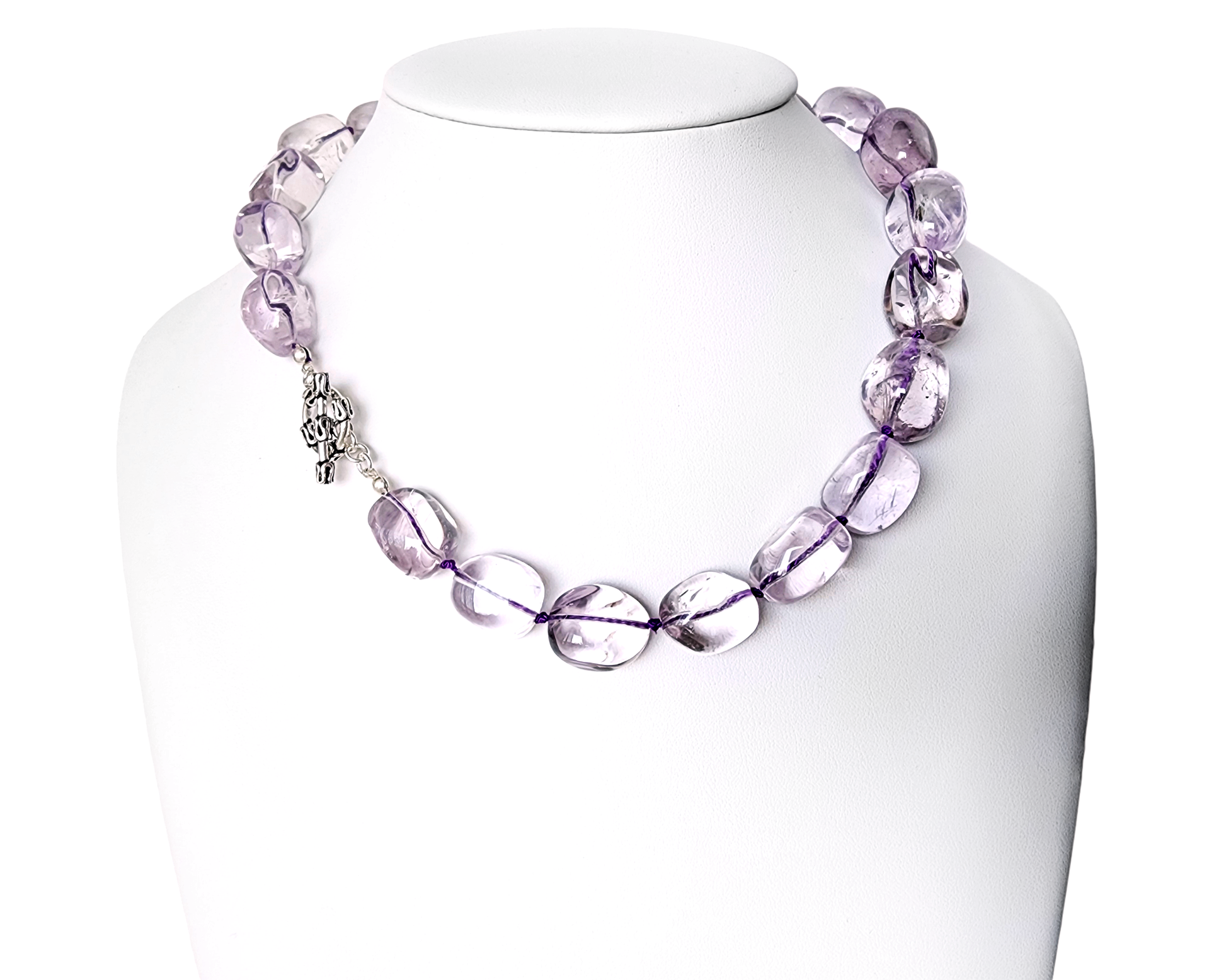 Translucent lavender Amethyst Nugget necklace, hand knotted with genuine Silk cord, finished with Sterling Silver and fancy antiqued Toggle Clasp on white display 