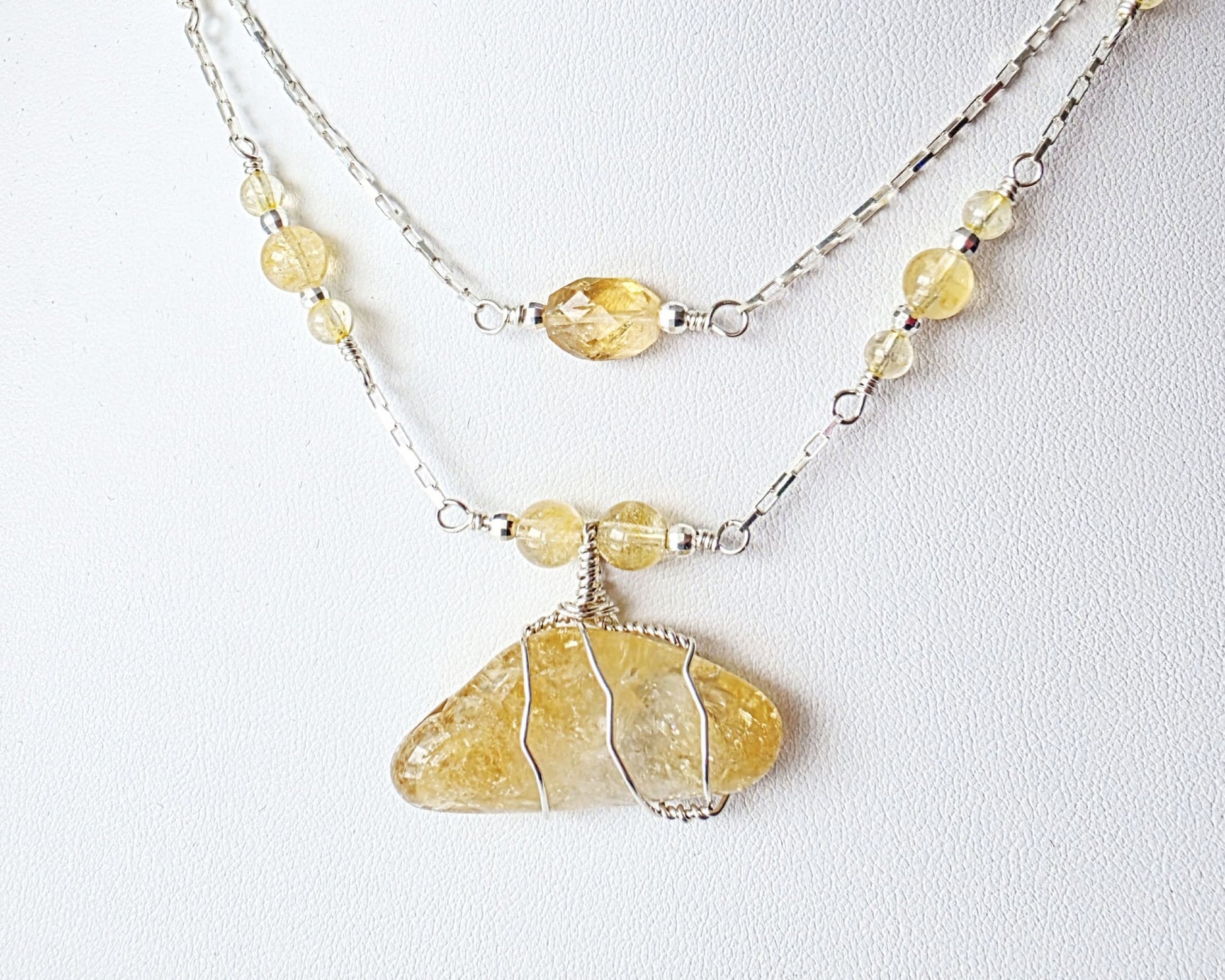 Double Strand Sterling Silver chain and yellow Citrine Gemstone necklace with large pendant on white display  