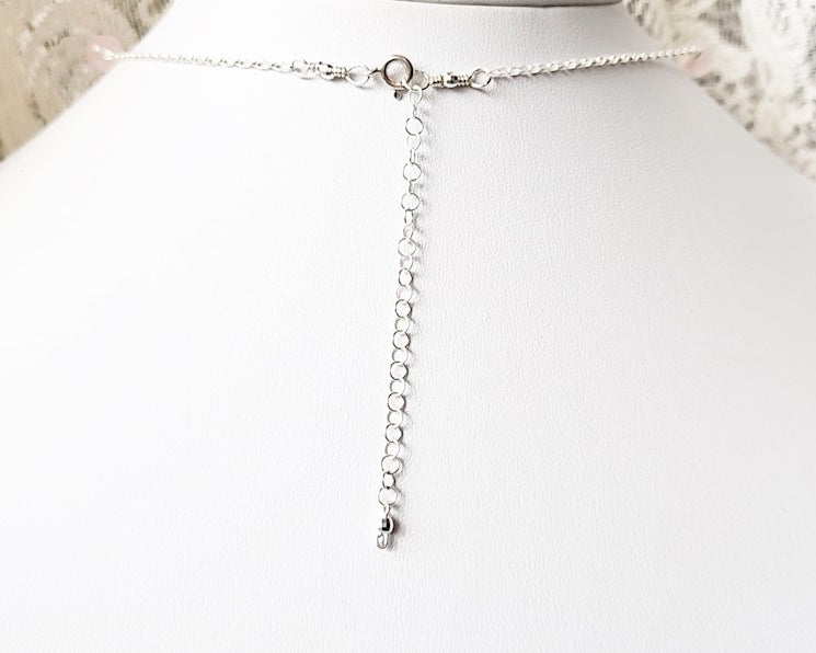 Long back chain, Sterling Silver extension chain with lobster claw clasp on white display bust
