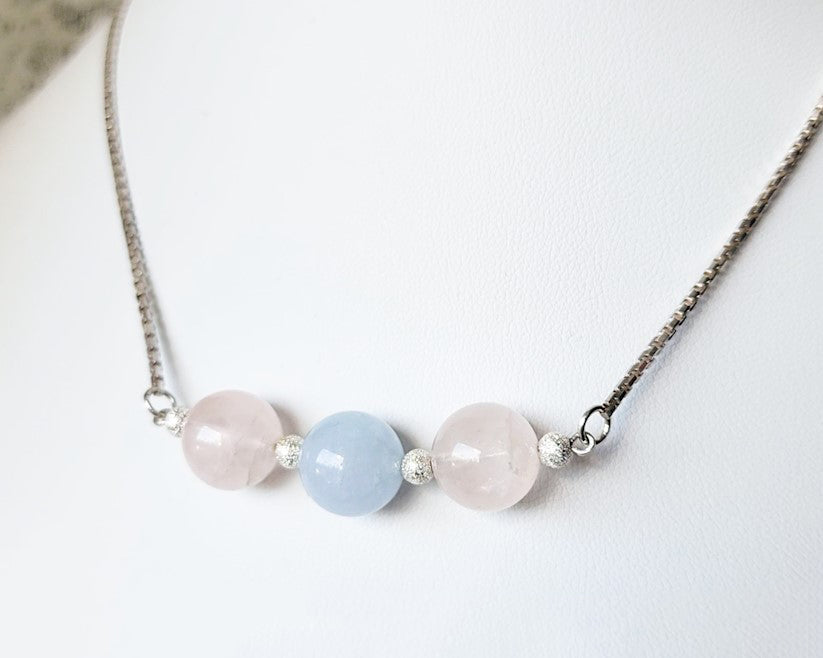 Three Gemstone Necklace with two Rose Quartz on either side of an Aquamarine in the centre box link Sterling Silver chain and extension chain. 