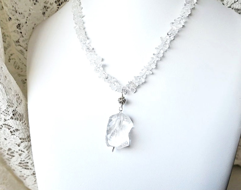 Sterling Silver, Clear Quartz (Rock Crystal) beaded necklace with a large Clear Quartz nugget pendant, antiqued Sterling Silver bead & Celtic Eternity Coil, fastens with a round Toggle clasp. 