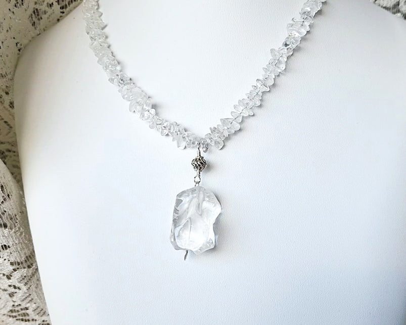 Sterling Silver, Clear Quartz (Rock Crystal) beaded necklace with a large Clear Quartz nugget pendant, antiqued Sterling Silver bead & Celtic Eternity Coil, fastens with a round Toggle clasp. 