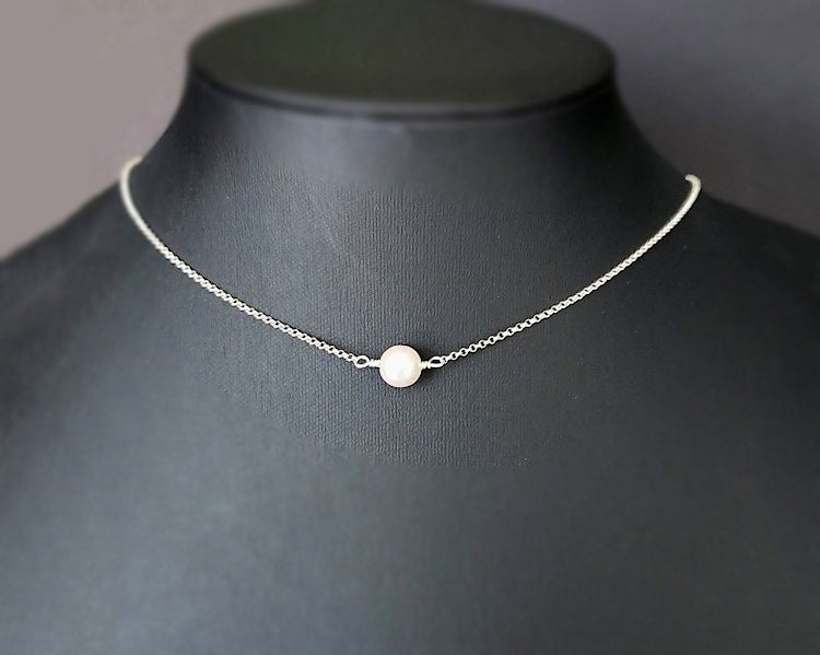 Floating Freshwater Cultured Pearl Necklace with a single white pearl in the centre of the Sterling Silver rolo style chain. 