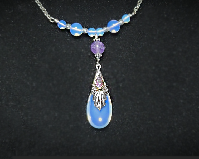 Sterling Silver Art Deco Style Opalite Amethyst Necklace with large drop shape synthetic opal, faceted Amethyst dangling from round Amethyst and Opalite beads and Chain on black background 