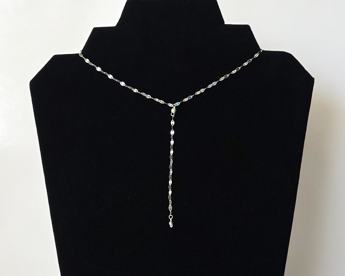 Sparkly Sterling Silver Decorative Chain Lariat necklace with brilliant flat decorative chain, sparkly faceted beads on black background