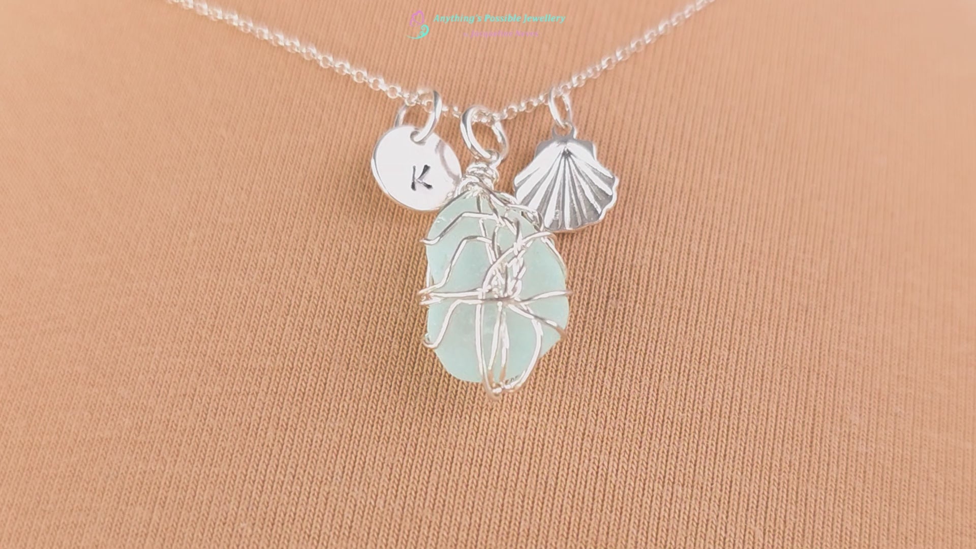 Video of Silver Sea Glass Necklace with Aqua blue Sea Glass wire wrapped with shell & initial pendants on chain