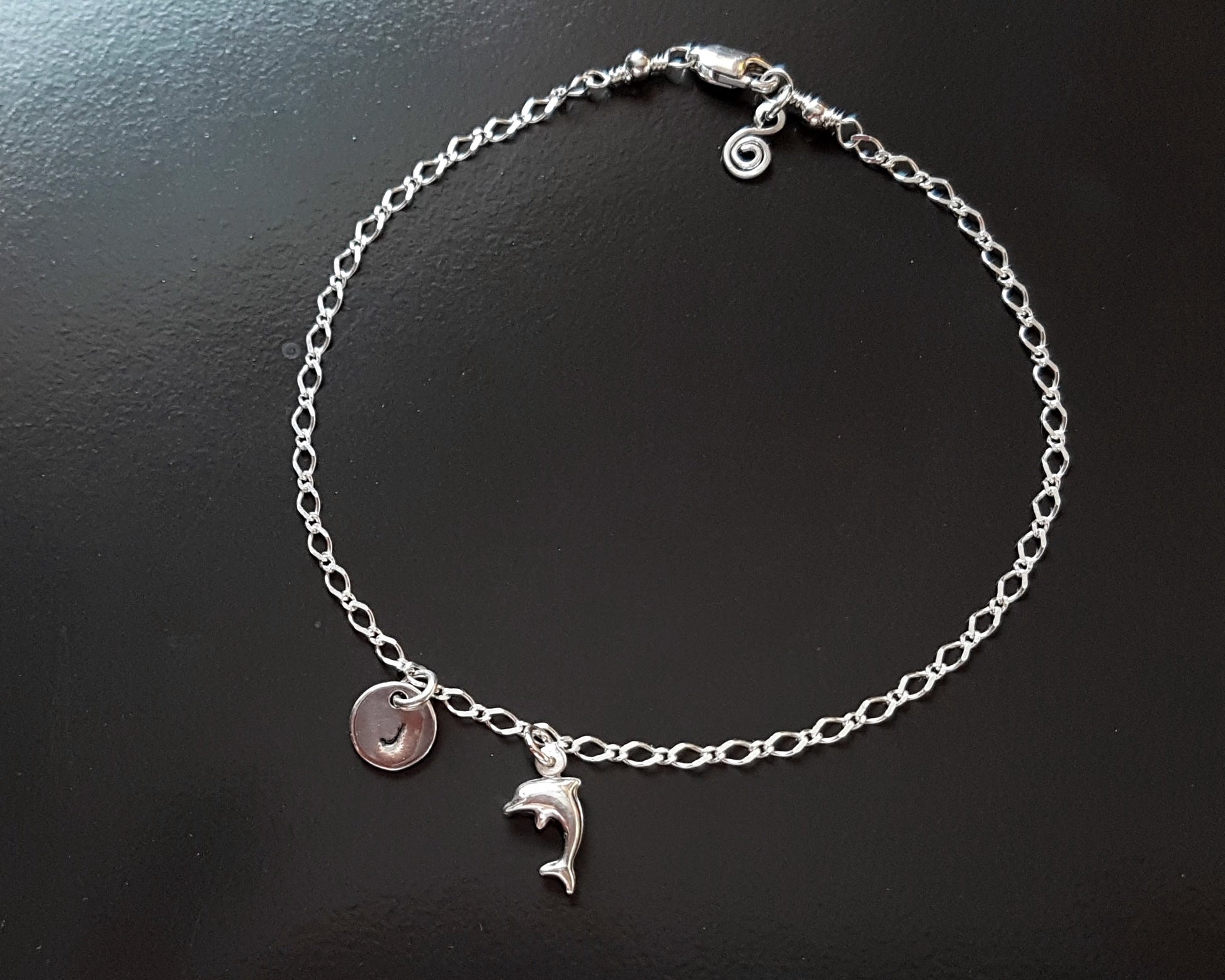 Personalized Silver Dolphin, Initial, Eternity Coil Ankle Bracelet-Anklet with a Dolphin pendant and round disk shaped Initial pendant dangling from flat figaro style chain 