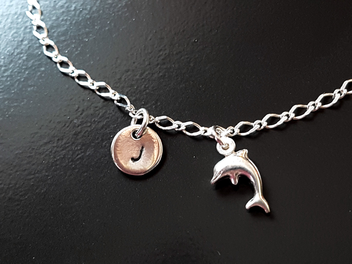 Personalized Silver Dolphin, Initial, Eternity Coil Ankle Bracelet-Anklet with a Dolphin pendant and round disk shaped Initial pendant dangling from flat figaro style chain 