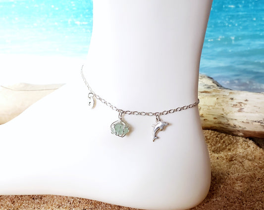 Sterling Silver Dolphin Aqua Blue Beach Glass Anklet, Ankle Bracelet-Anklet with round Initial pendant, dolphin pendant on flat figaro chain with beach background 