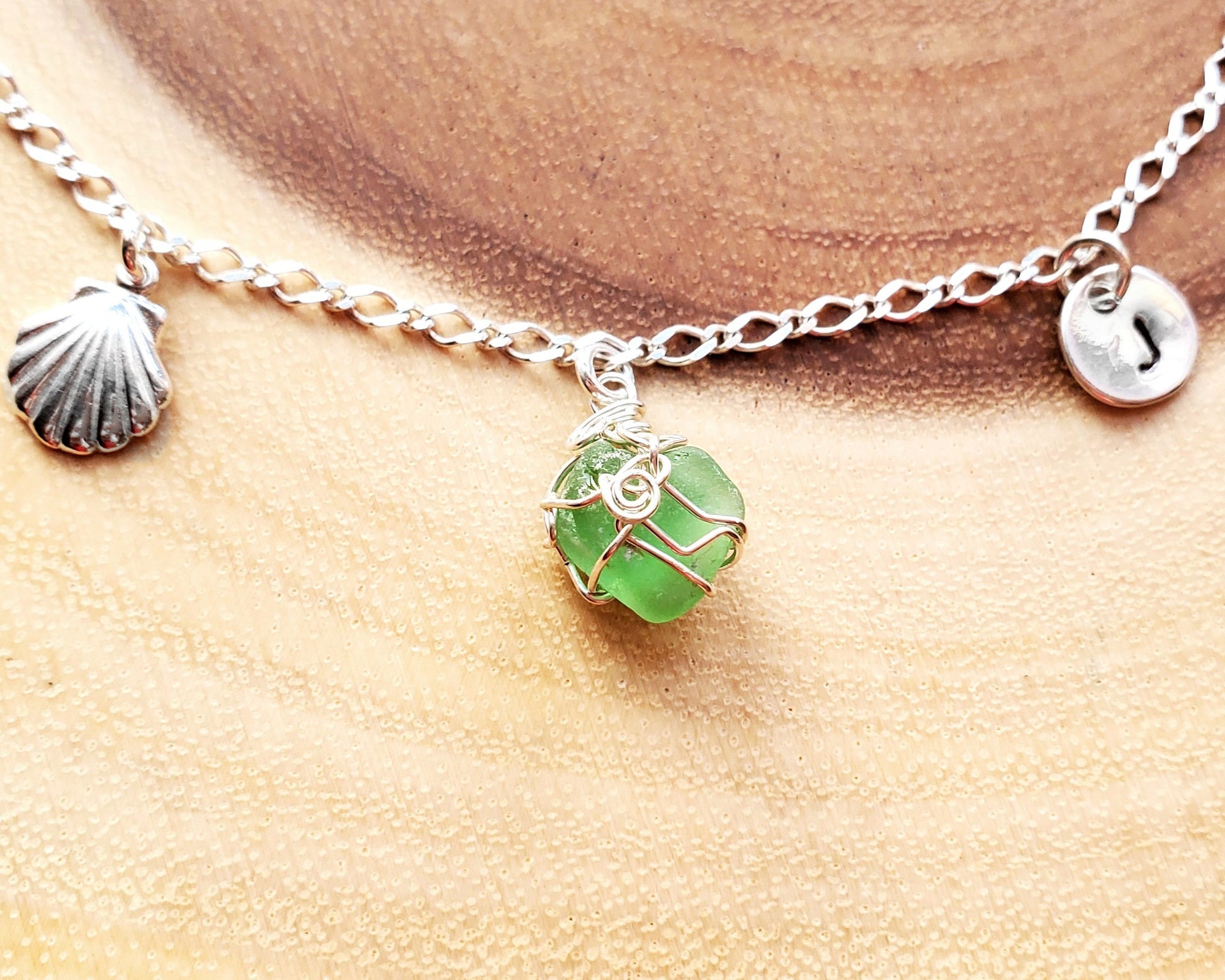 Deluxe Personalized Emerald Green Beach Glass Shell Ankle Bracelet, Anklet, wire wrapped green pendant, hand stamped initial pendant, shell pendant and Celtic eternity coil pendant on chain.