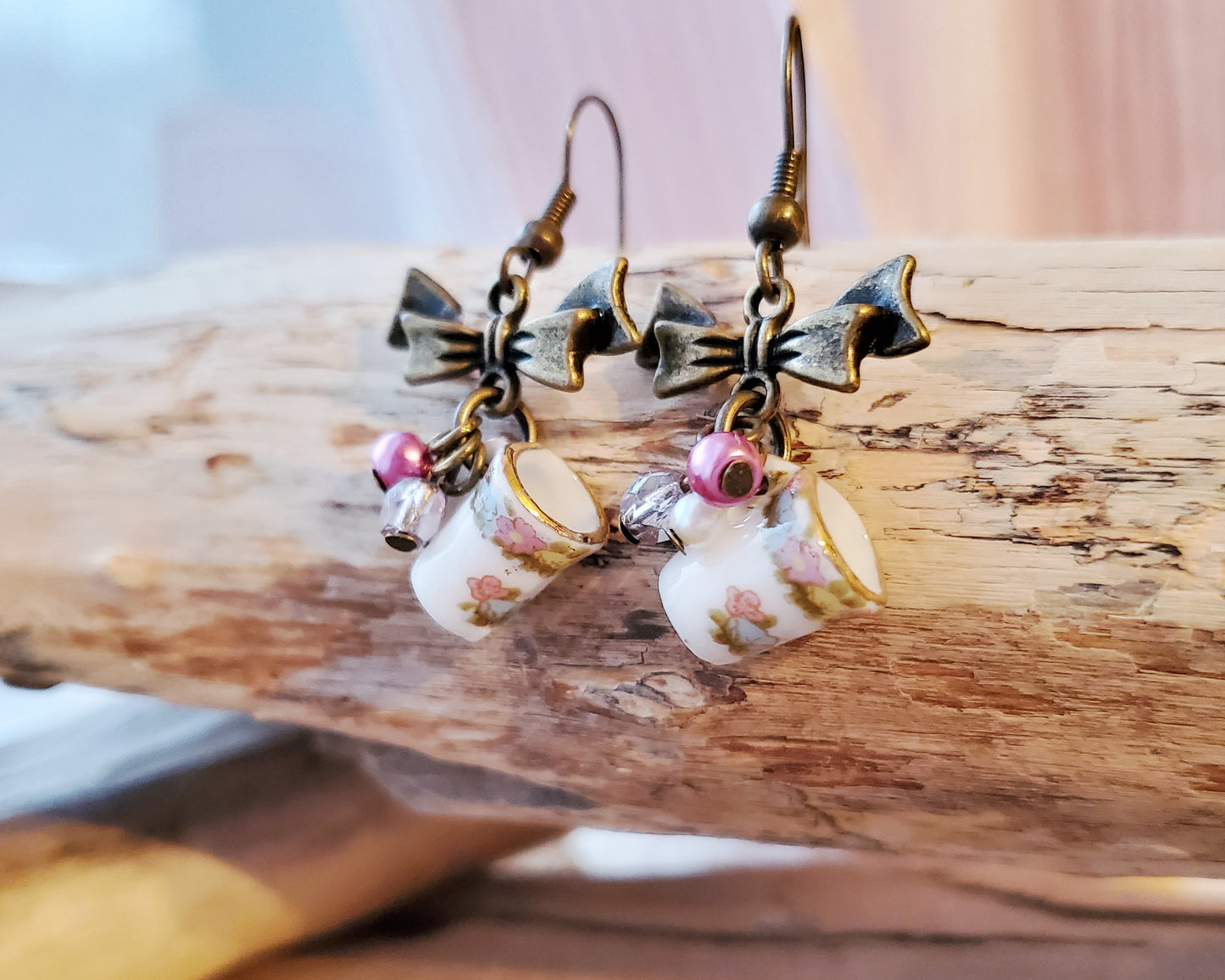 Shabby Chic, Vintage Coffee Cup Earrings displayed on beach wood