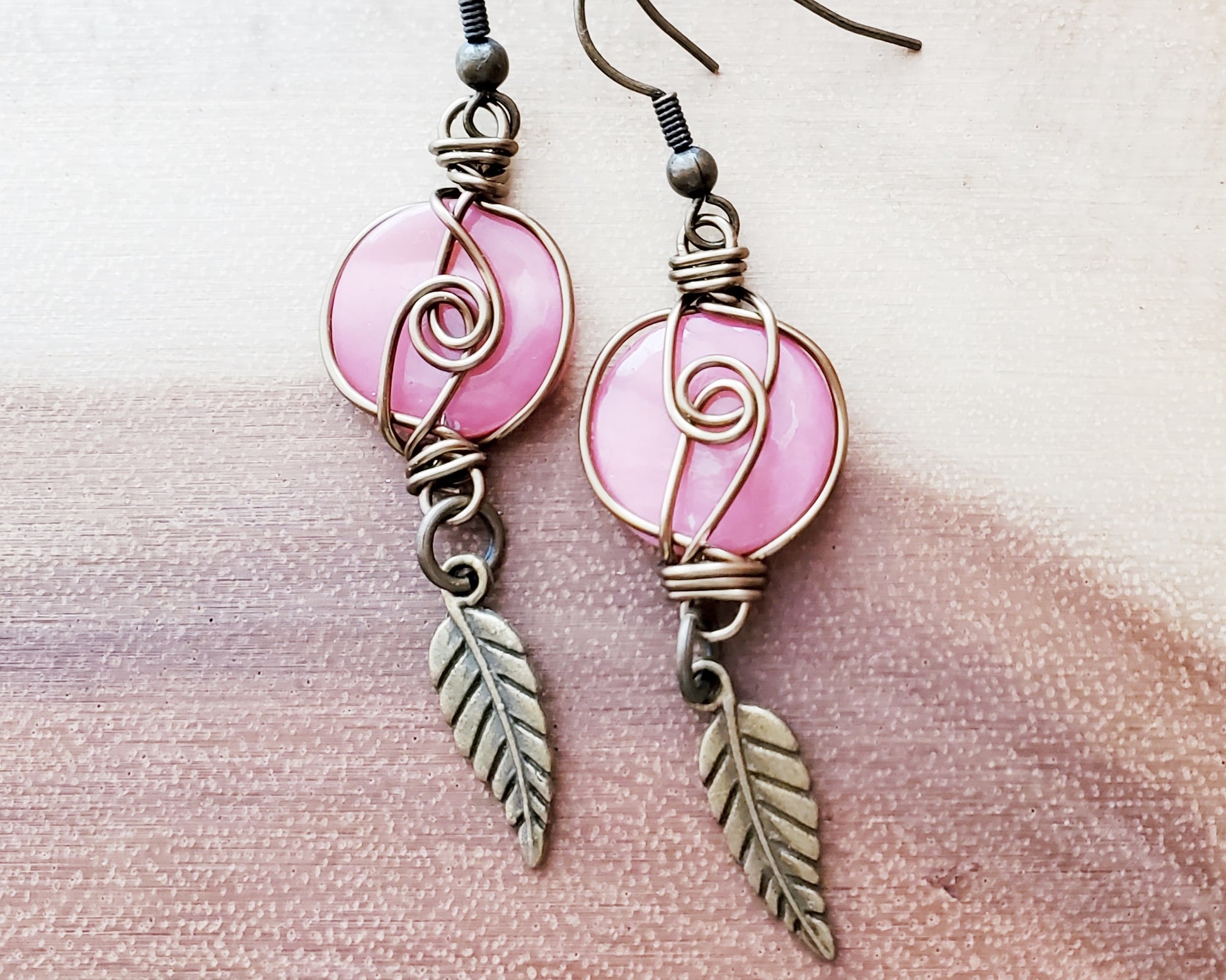 Long Eco Pink Shell Feather Earrings made with Vintage pink Shell disks, wire wrapped with dangling Feather pendants.  