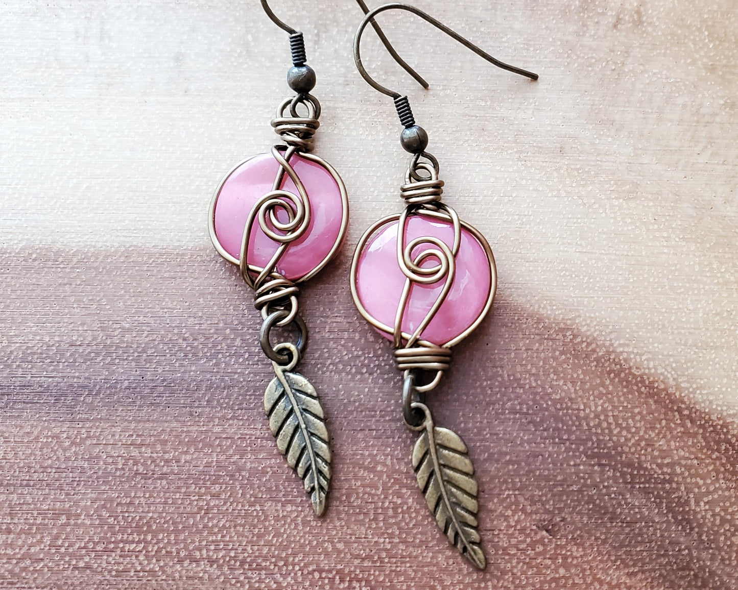 Long Eco Pink Shell Feather Earrings made with Vintage pink Shell disks, wire wrapped with dangling Feather pendants. 