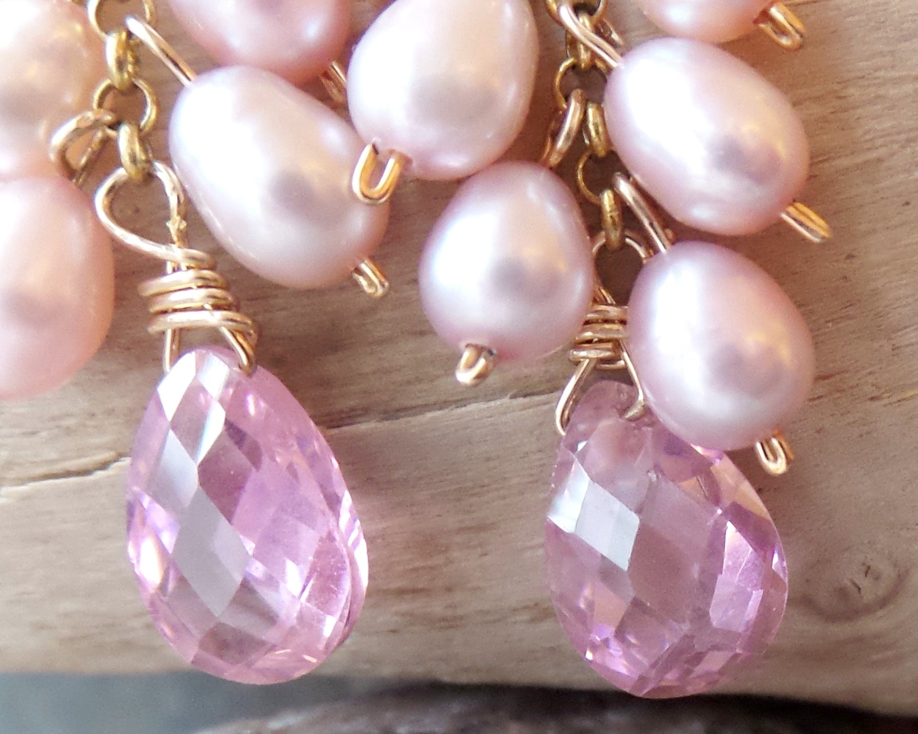 Long Pink Pearl Cubic Zirconia Cluster Earrings, handmade with faceted, drop shaped Cubic Zirconia and a long cluster of dangling pink Freshwater Cultured Pearls. 