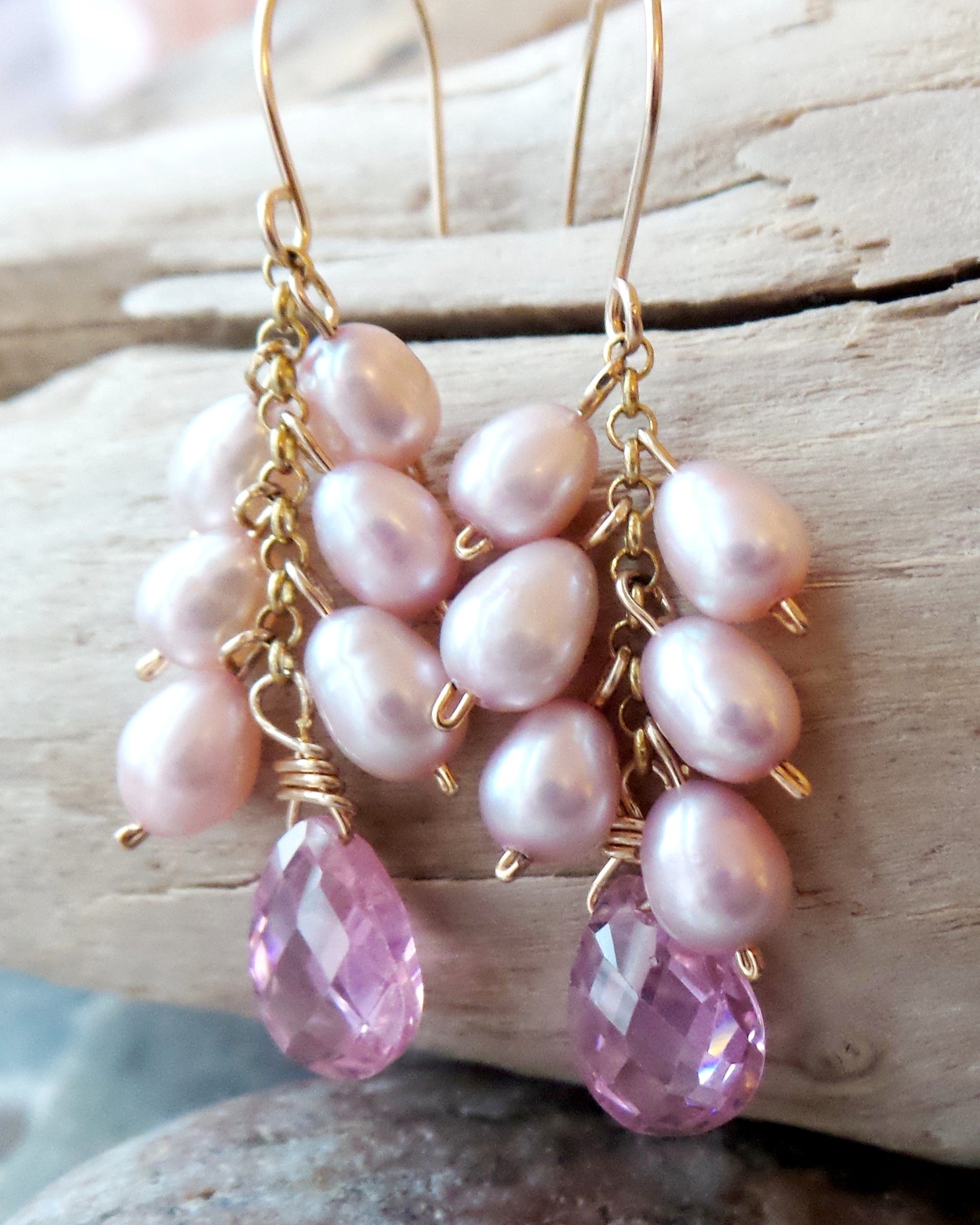 Long Pink Pearl Cubic Zirconia Cluster Earrings, handmade with faceted, drop shaped Cubic Zirconia and a long cluster of dangling pink Freshwater Cultured Pearls. 