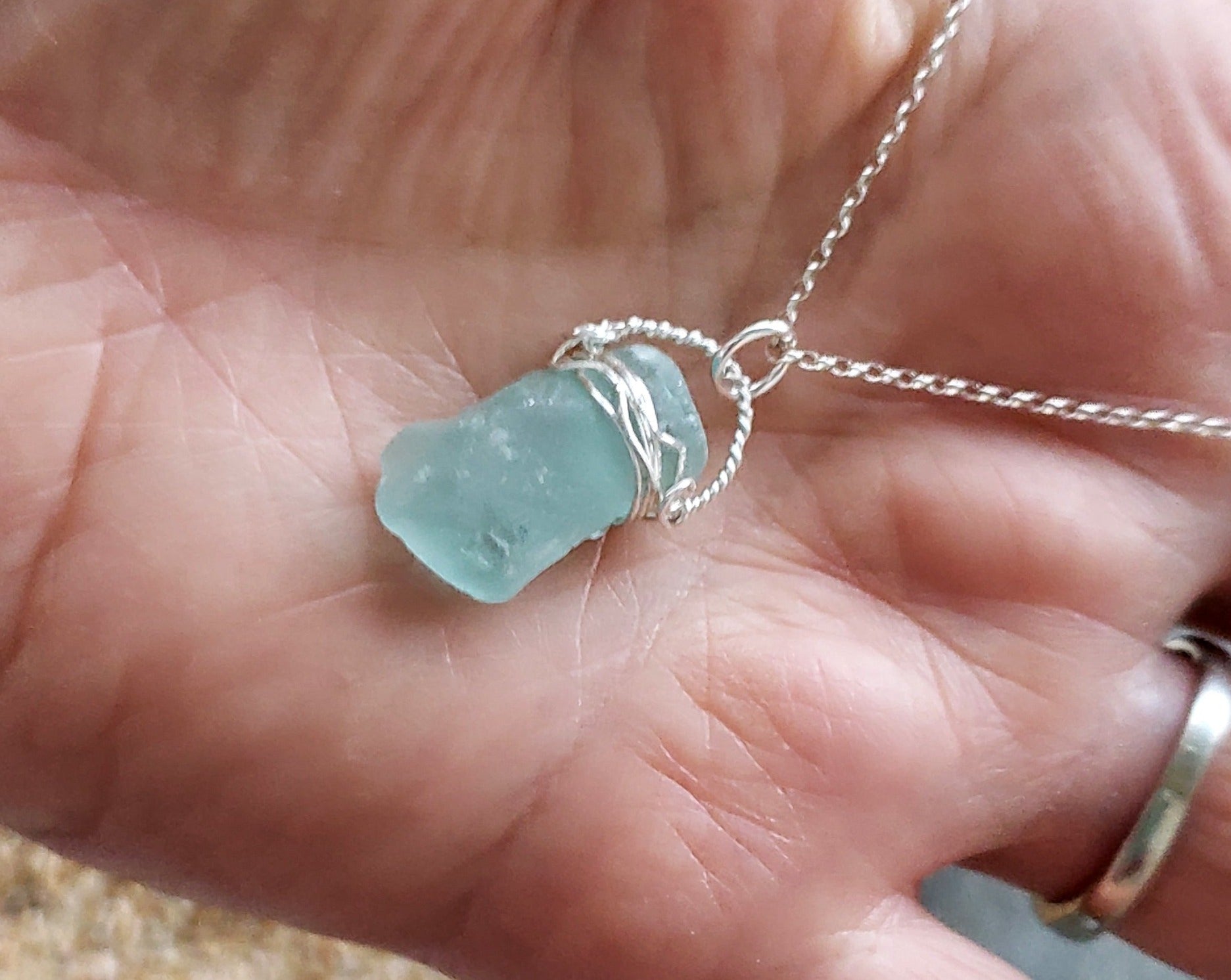 Aqua Blue Beach Glass Serenity Pendant Necklace, photo on hand