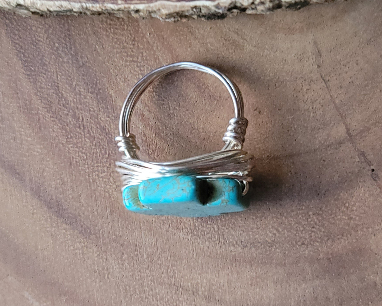 A Large Turquoise Cross Ring, wire wrapped ring made with high quality silver plated, copper base wire and a large symmetrical stone Cross.