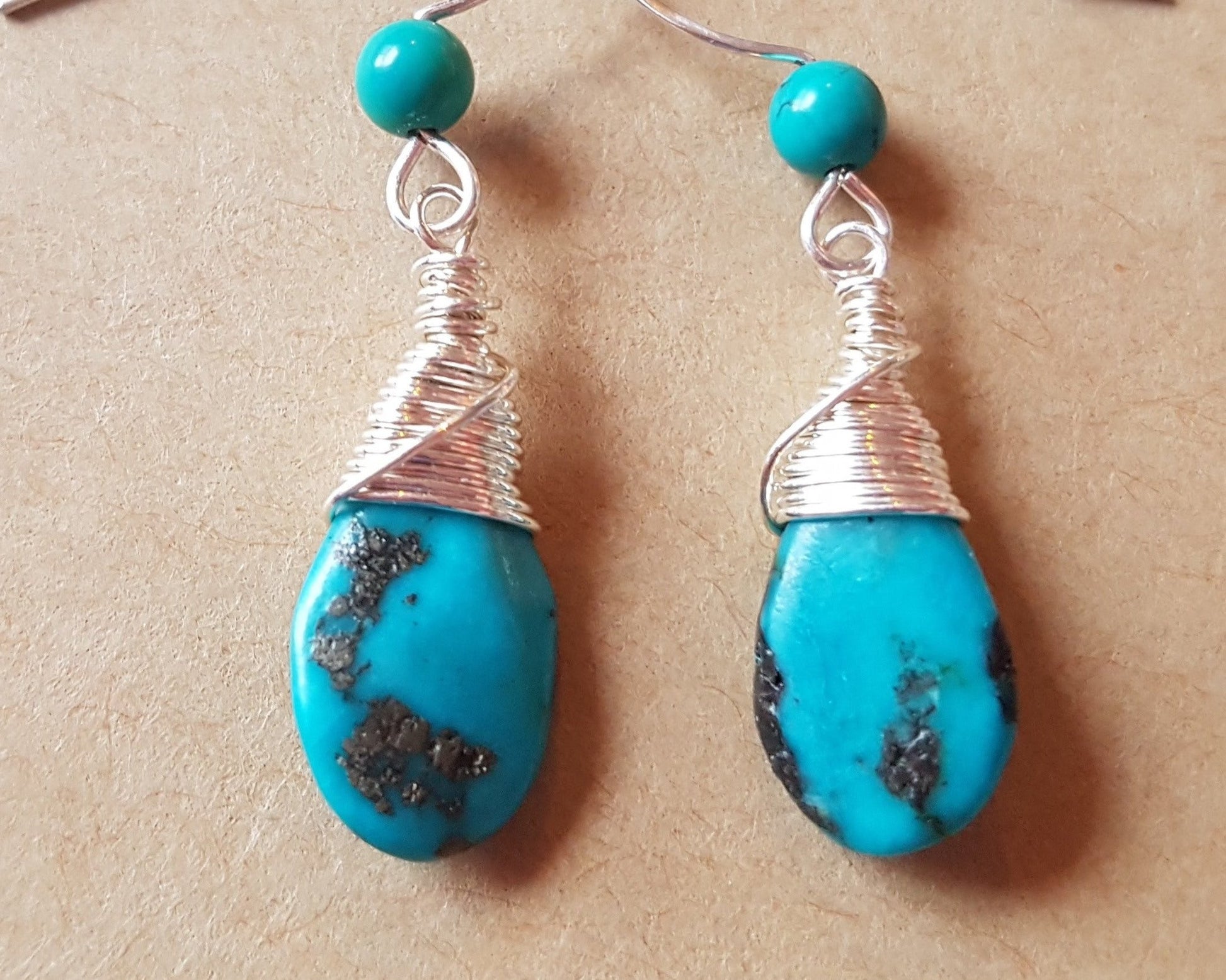 Long Elegant Turquoise Dangle Earrings, Sterling Silver and rich, deep turquoise stones, drop shaped briolette’s, smaller round turquoise on the french style earrings hooks