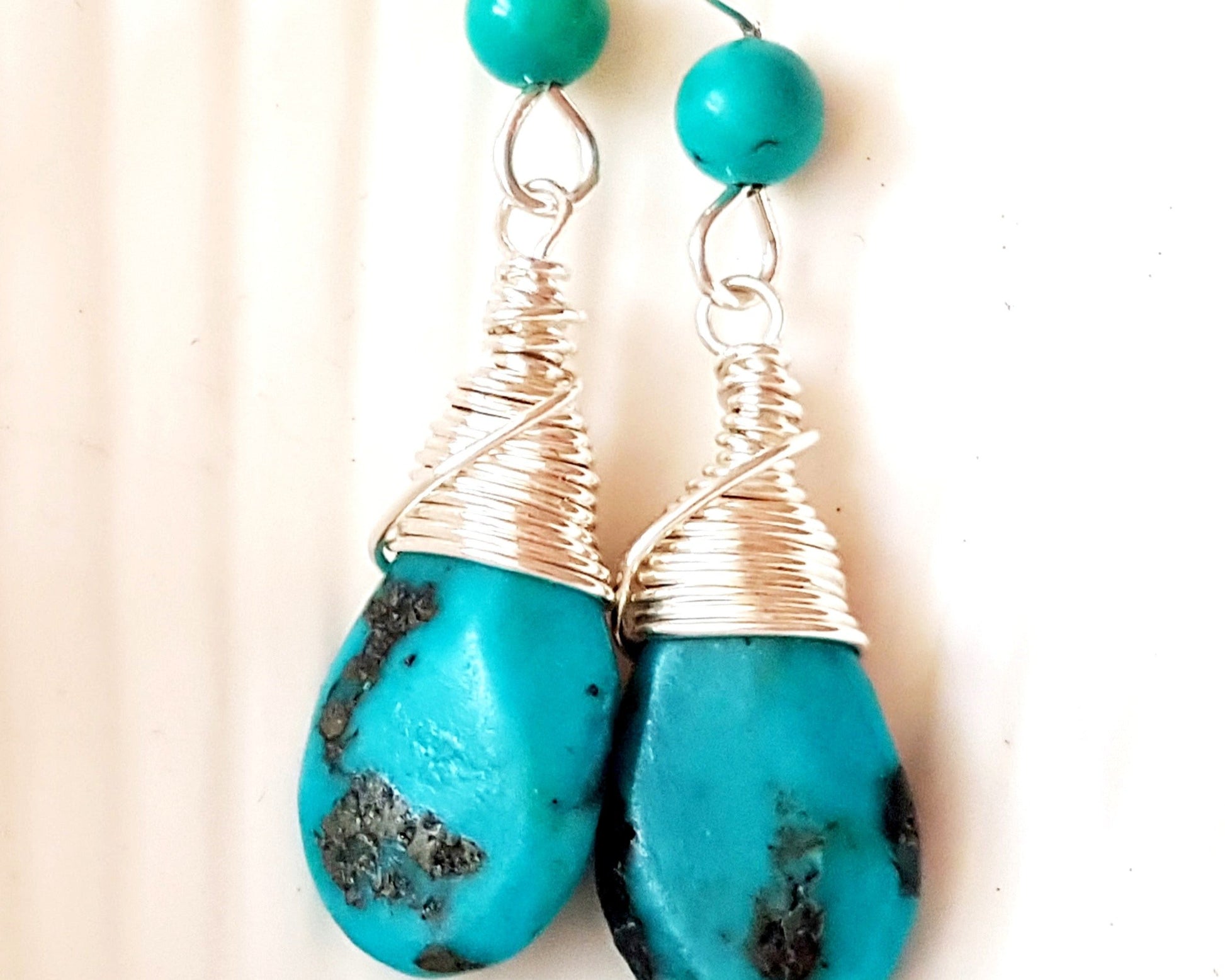 Long Elegant Turquoise Dangle Earrings, Sterling Silver and rich, deep turquoise stones, drop shaped briolette’s, smaller round turquoise on the french style earrings hooks